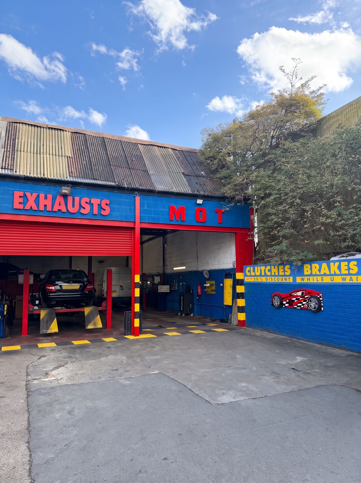 The DriveRyte workshop on Leagrave Road, with the Exhausts and MOT bays and the Clutches and Brakes wall